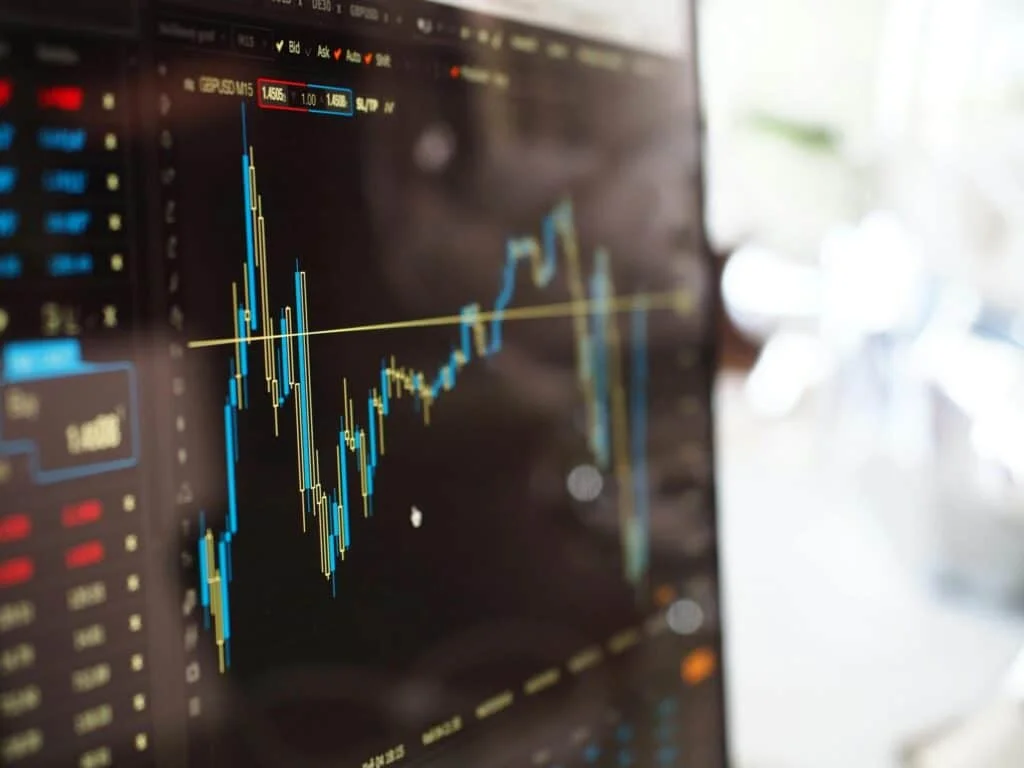 pexels-photo-159888-159888 Detailed view of financial trading graphs on a monitor, illustrating stock market trends.